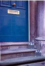 Blue Door with Milk Bottles